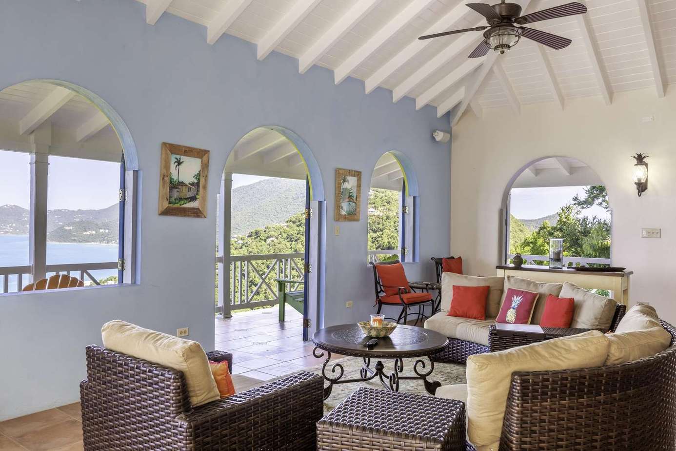 Airy living room with vaulted ceilings and waterfront views