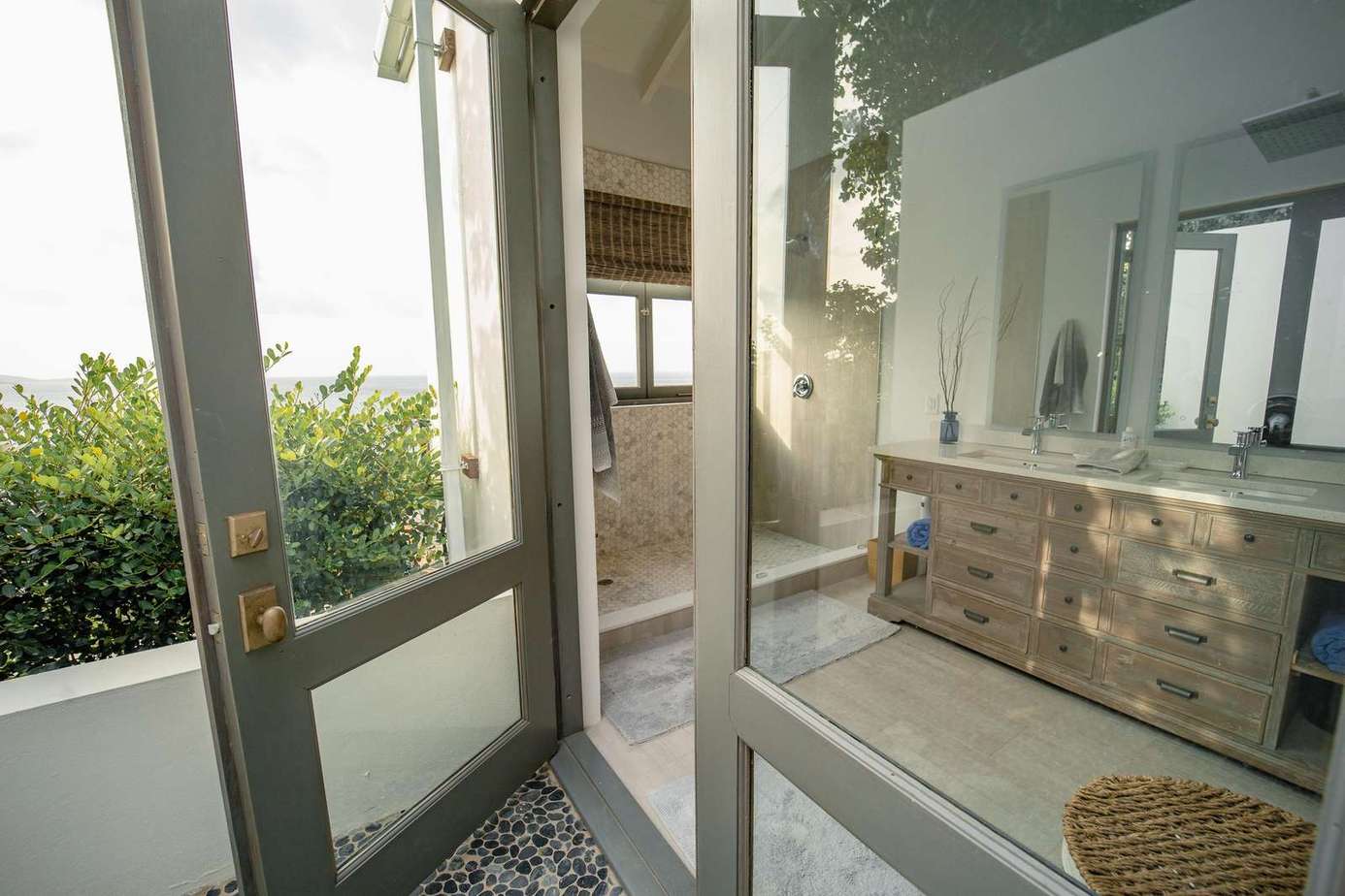 Primary ensuite bathroom with outdoor shower