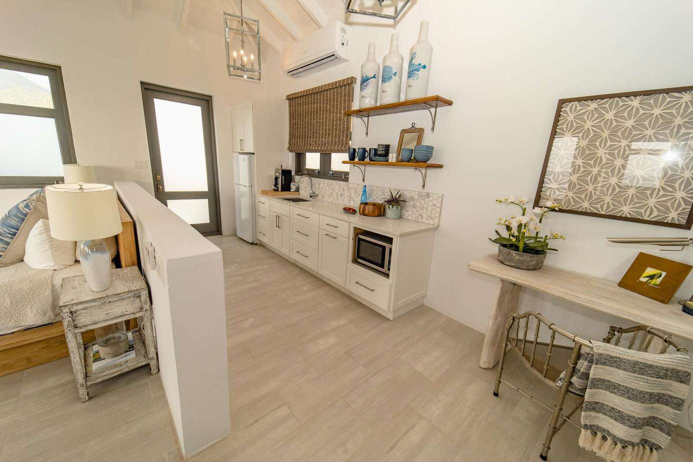 The Primary Suite features a king bed, daybed and convenient kitchenette with fridge, microwave, toaster and coffee-maker