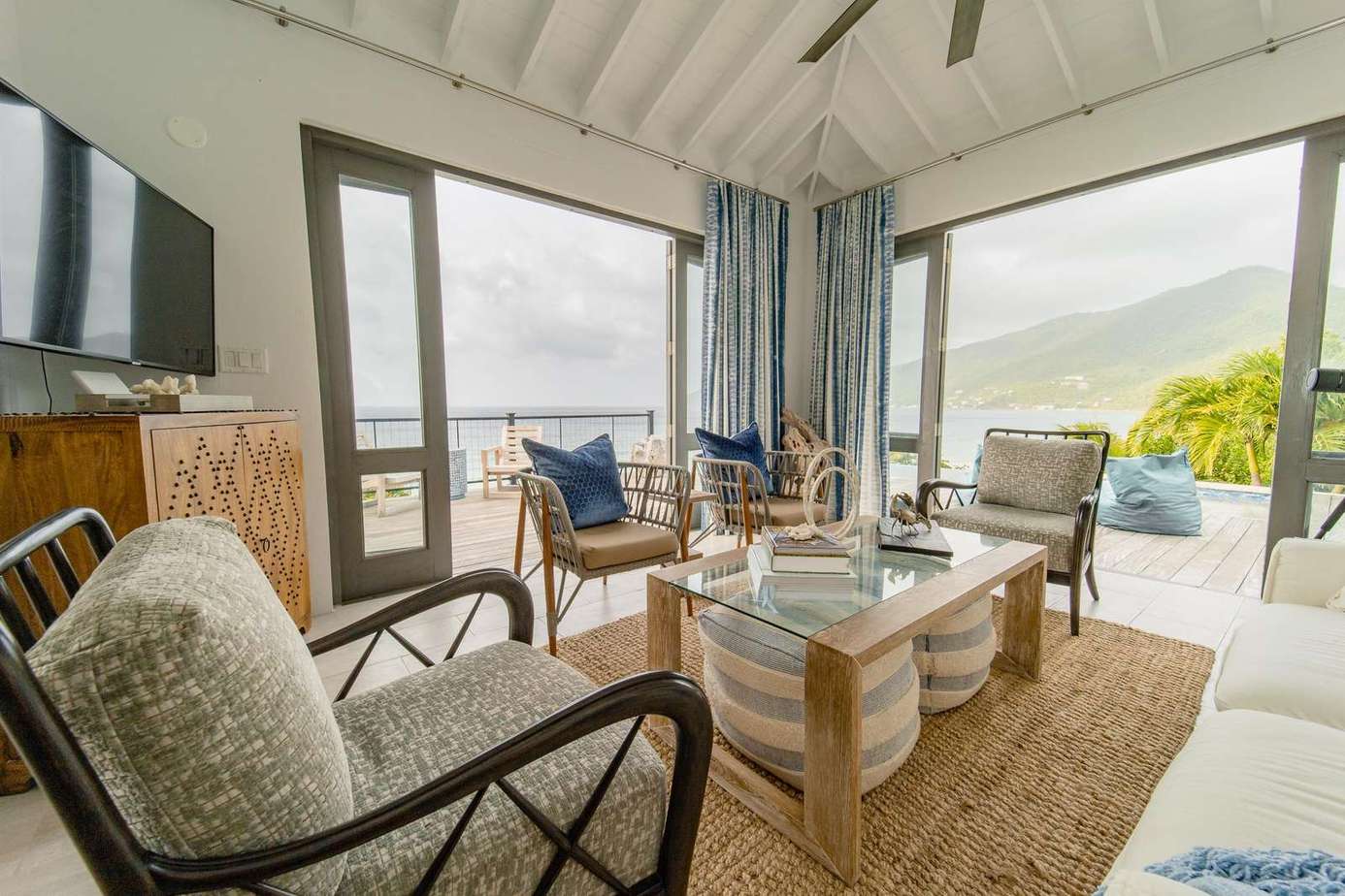 The breeze along Long Bay beach cools the beautiful living room that opens up for true indoor-outdoor living. Or close up the glass doors for an air-conditioned cool down.
