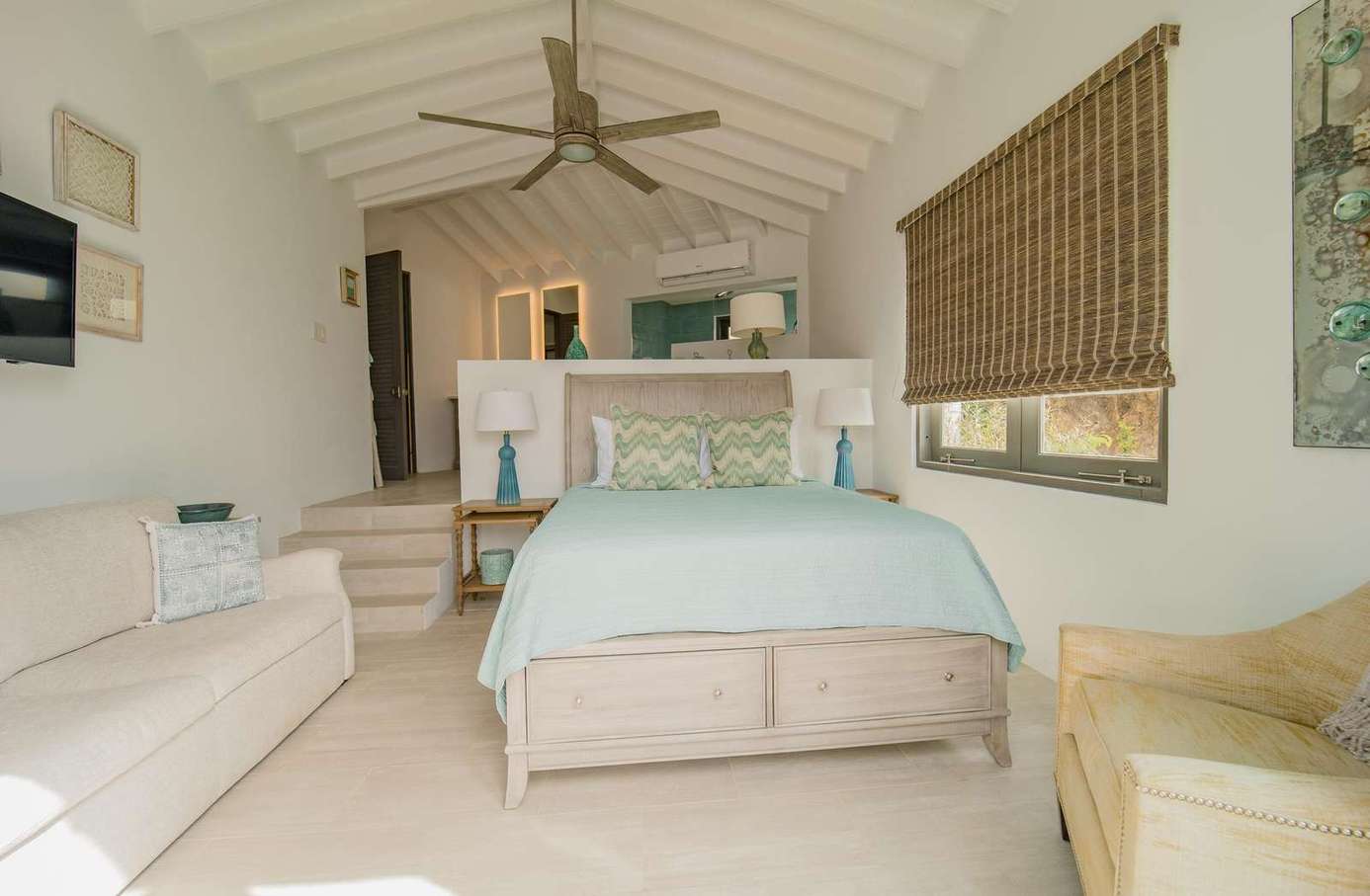 Bedroom 2 has a queen bed looking out towards the ocean