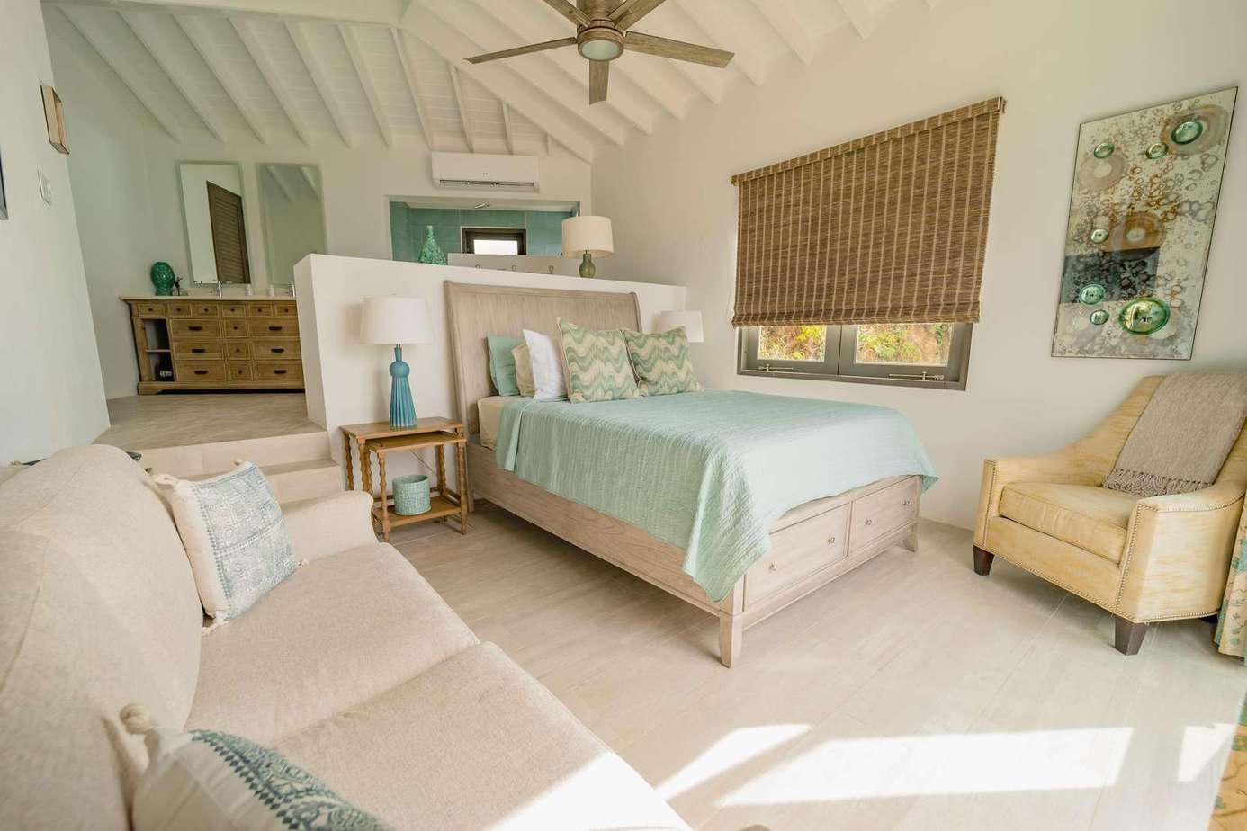 Bedroom 2 has a queen bed and spacious dressing and bathroom area.