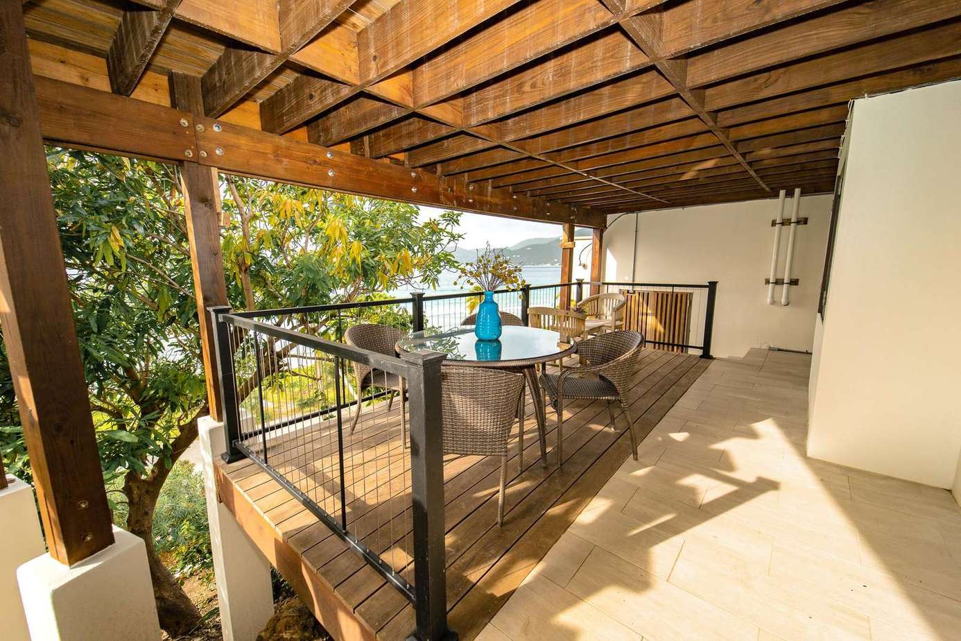 This cool and shady porch is just for the 4th bedroom and an awesome spot for a quiet morning coffee before a fun-filled day with friends and family
