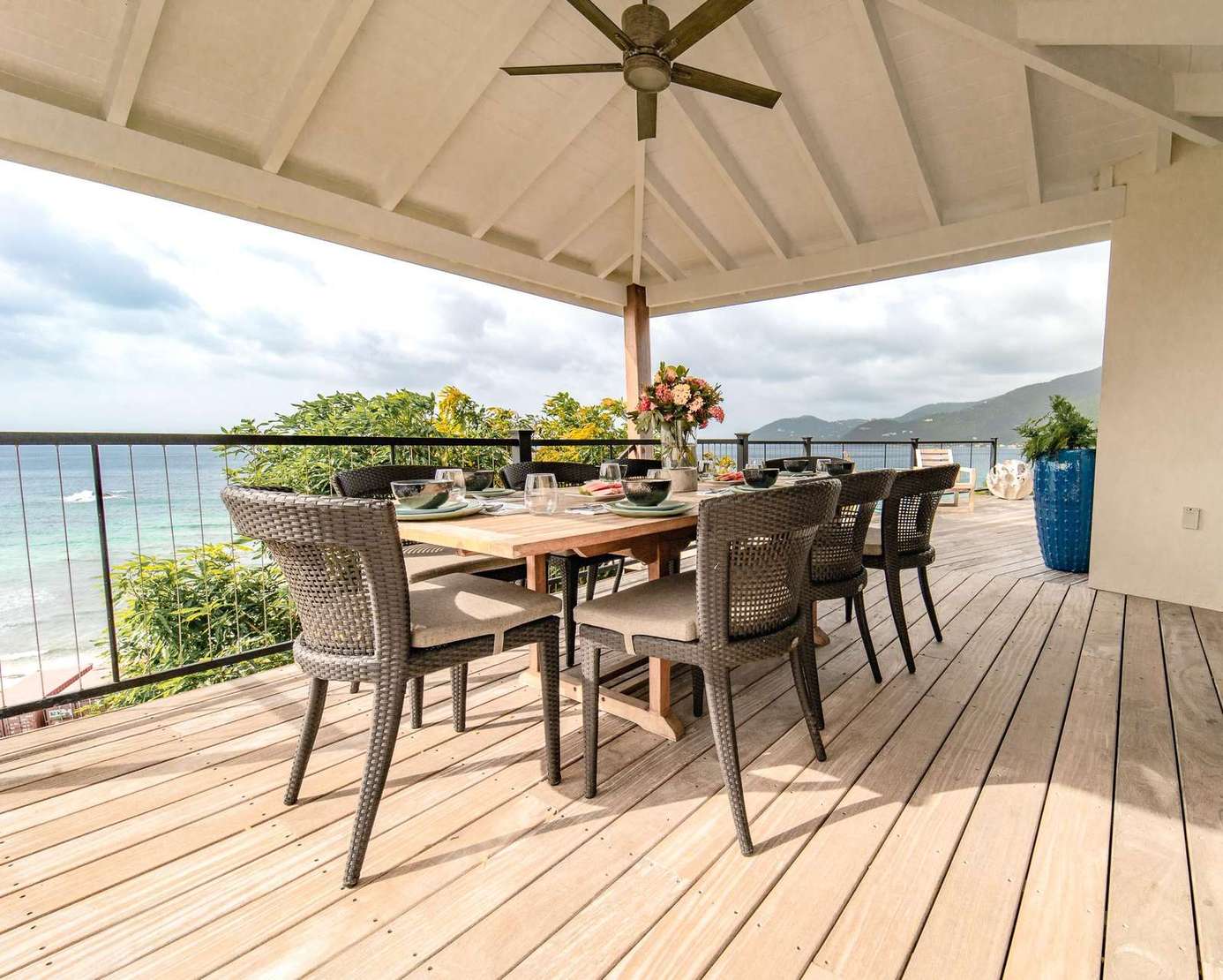 Spacious, covered outdoor dining for 8 with the kitchen adjacent and the sound of the waves just yards away