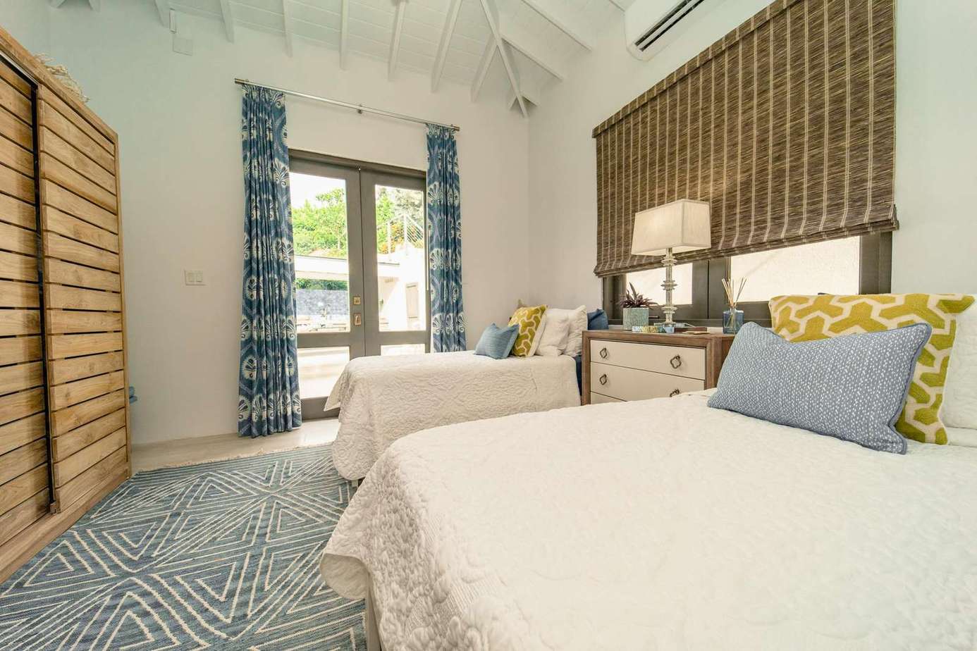 Bedroom 3 overlooking the pool deck and the ocean beyond