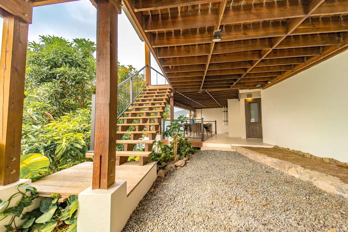 covered parking below the main deck with direct access to the 4th bedroom