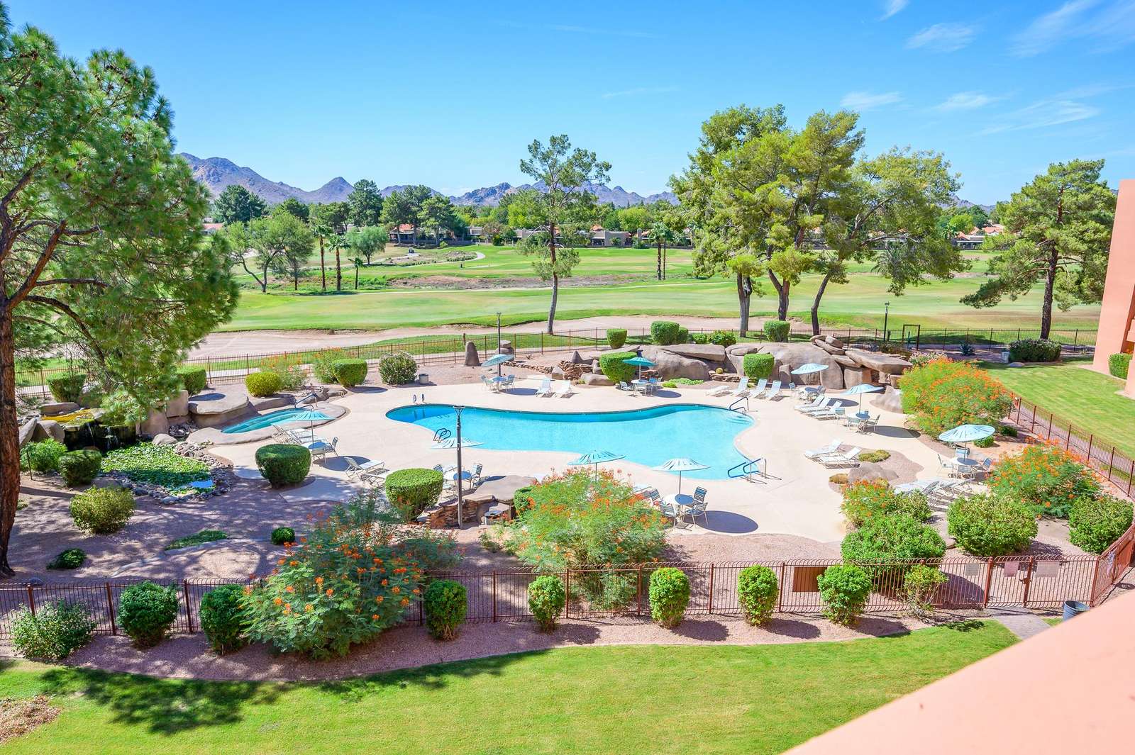 One of 5 Pools near by the unit with view of Golf Course beyond. - property