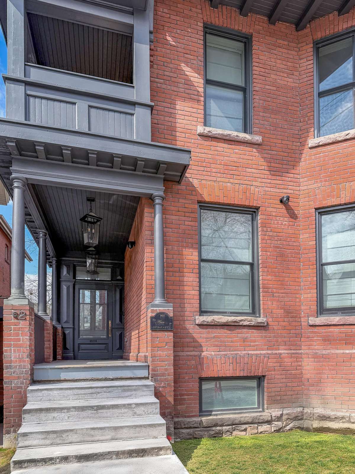 Charming brick exterior with welcoming front entrance steps