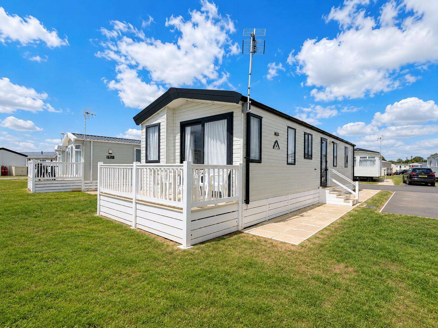 This beautiful caravan in Dovercourt is the perfect base for a UK staycation on the Essex coast. Open the patio doors and enjoy spending time on the outside decking in the sunshine. - property