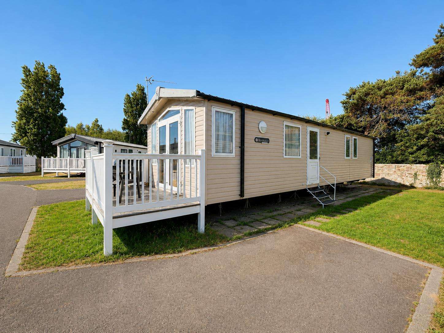 Escape to Essex for a bank holiday retreat and enjoy the comfort of a 3-bedroom, 8-berth caravan with decking at Naze Marine Holiday Park, ideal for last-minute weekend getaways. - property