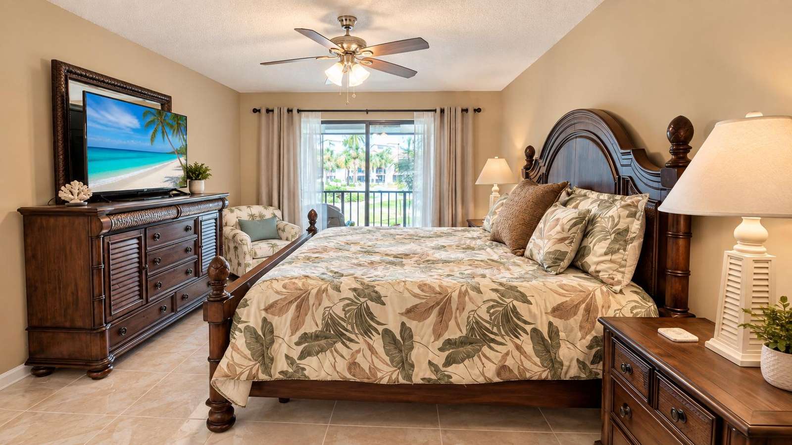 Master bedroom with King bed and balcony access with pond and pool views - property