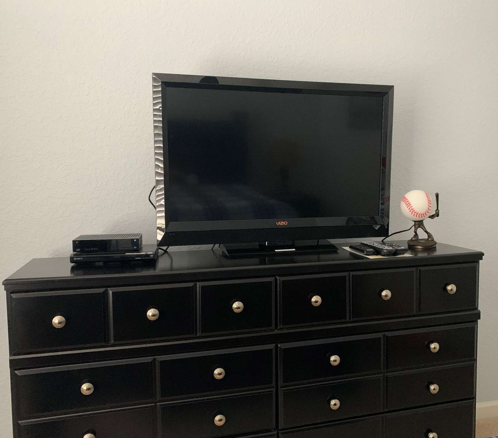 Queen bedroom flat screen TV and DVD player