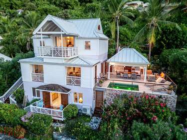 Spacious multi-level home with lush tropical surroundings