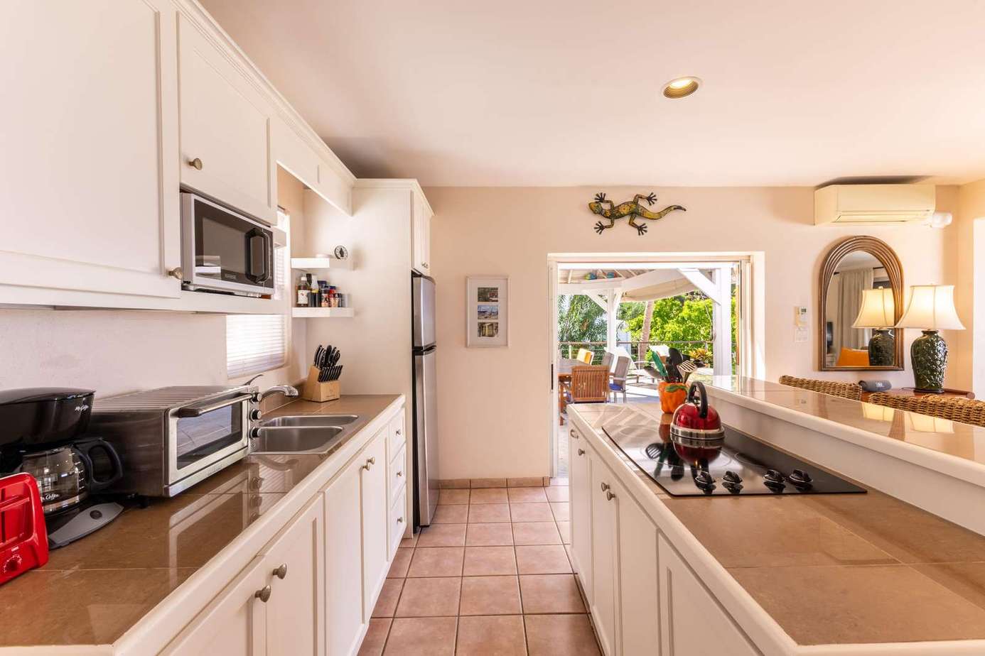 Bright, airy kitchen with garden views and cozy breakfast bar