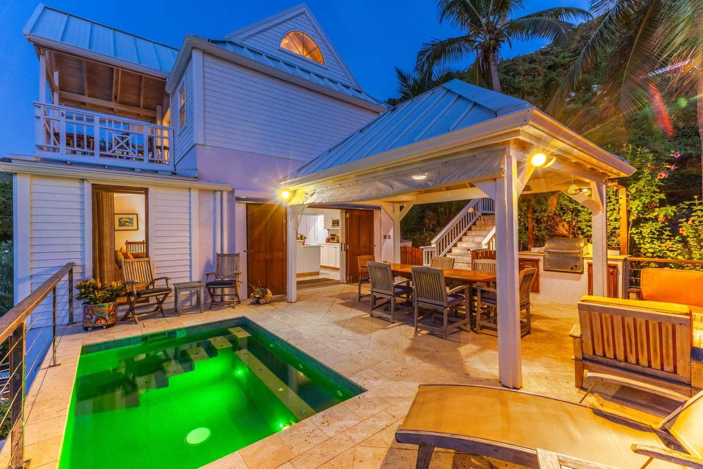 Private poolside patio with cozy seating and vibrant ambiance