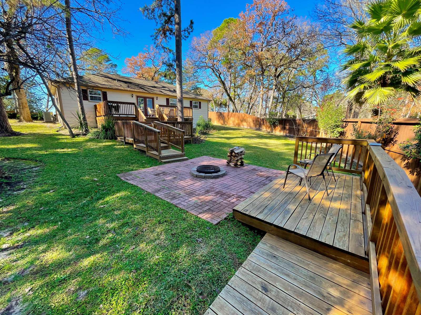 A wide view of the rear yard. Plenty of room for the kids to play, and maybe the adults too!