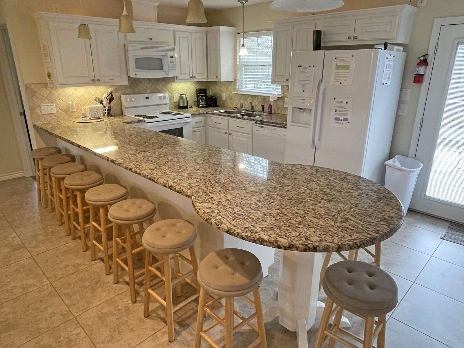The kitchen is roomy , has most appliances and is well equipped for most meals. Utensils are included.