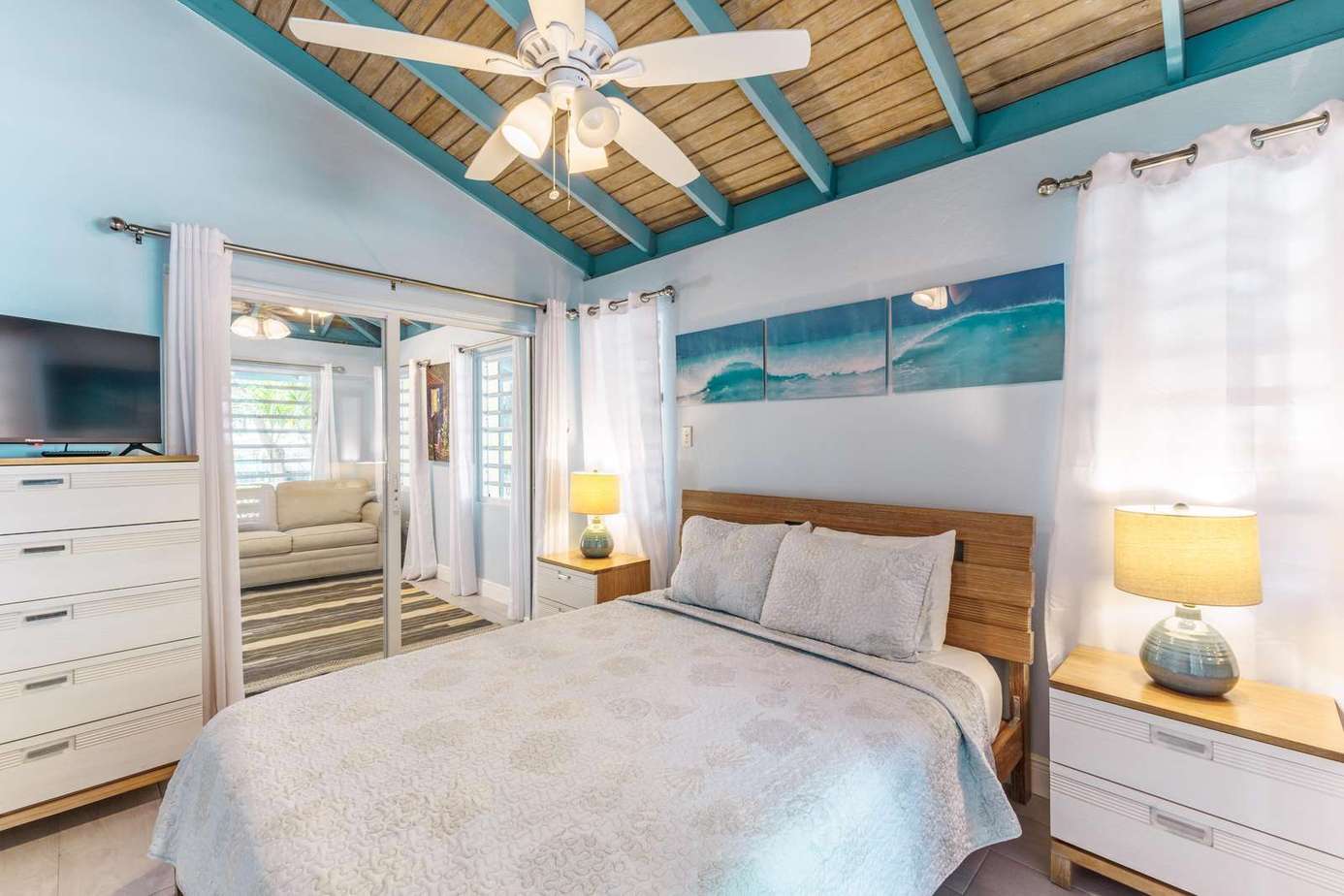 Cozy bedroom retreat with vaulted ceiling and natural light