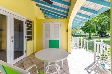 Sunny patio retreat with vibrant colors and garden views