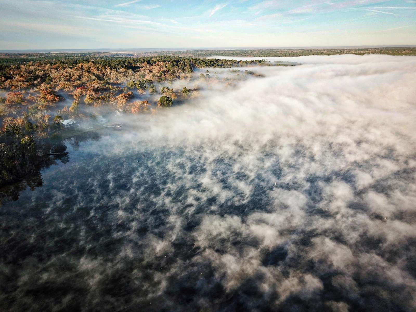 This phot of lake fog from a cool morning. When the water is warmer than the air, it forms steam the can engulf the entire lake.
