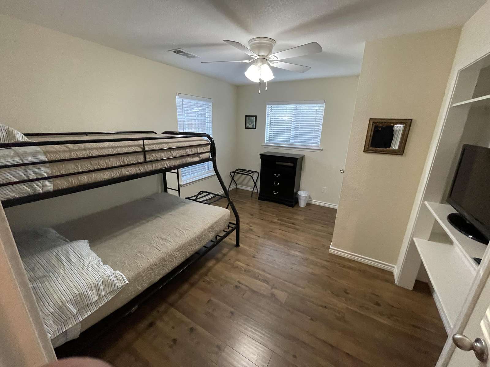 The bunk room with twin top full on bottom. To the right side is a 32" television w/cable.