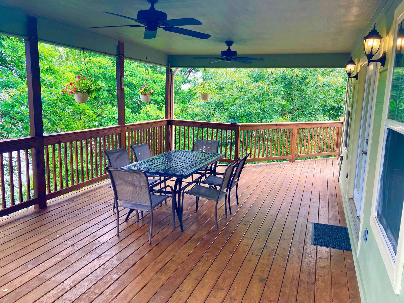We weren't joking when we nicknamed the home the Big Treehouse. This porch is nestled in the trees. There's plenty more decks if you don't like heights! lol