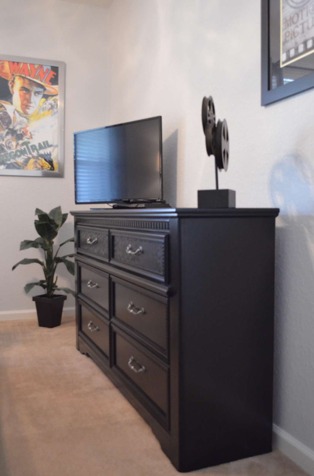 TV and DVD player in queen bedroom