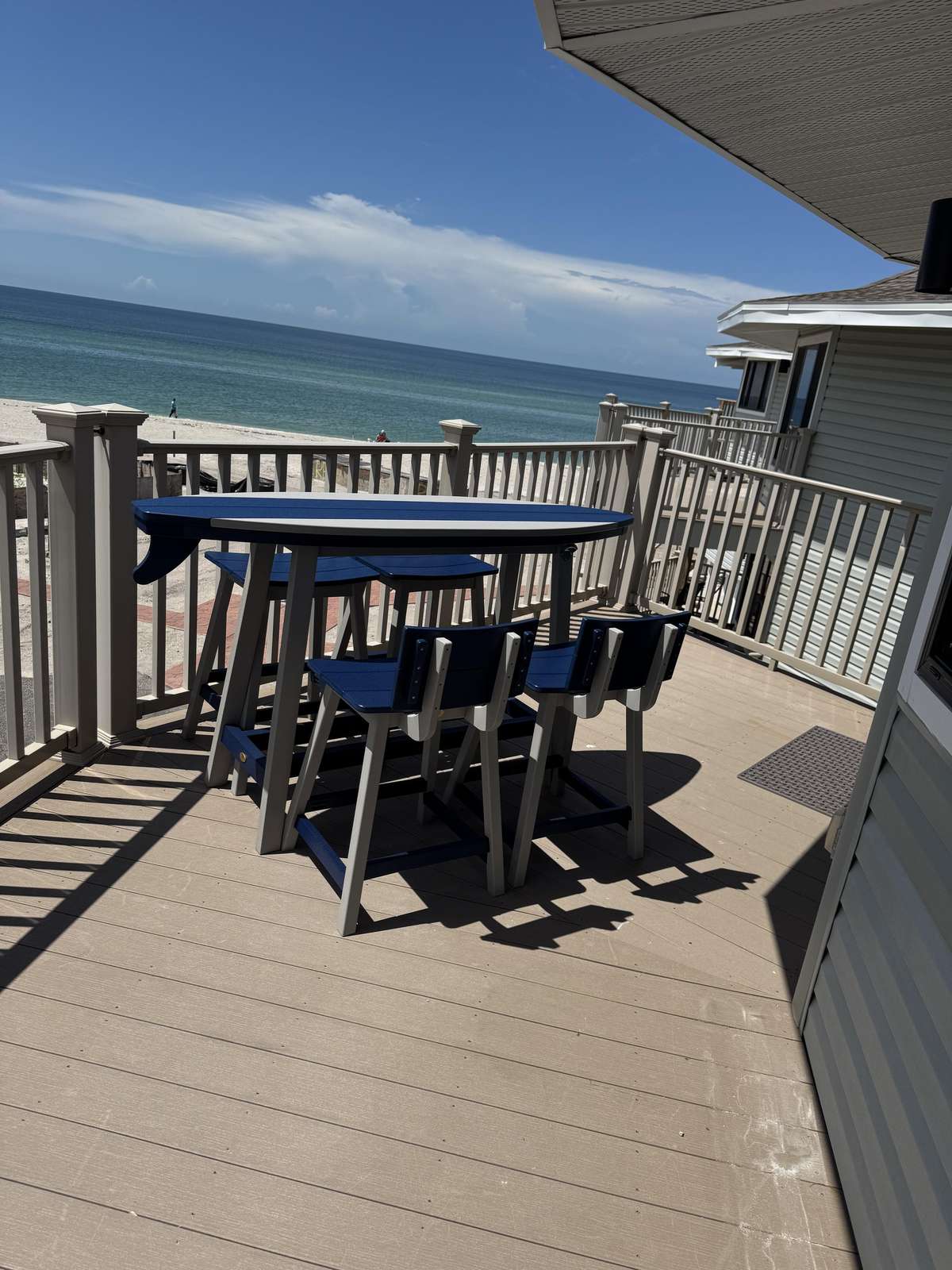 Oceanfront deck with table &amp; chairs and stunning water views