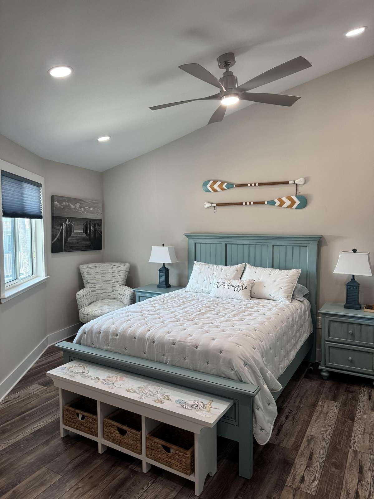 Cozy master bedroom with vaulted ceiling and natural light