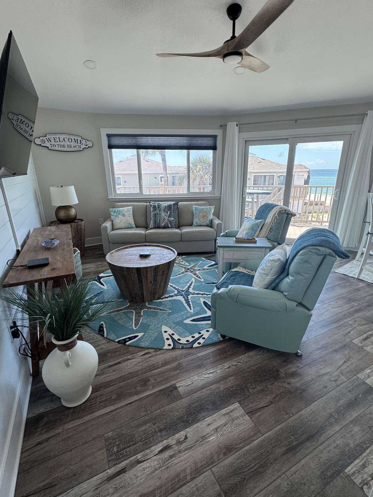 Cozy living room with panoramic windows and ocean views