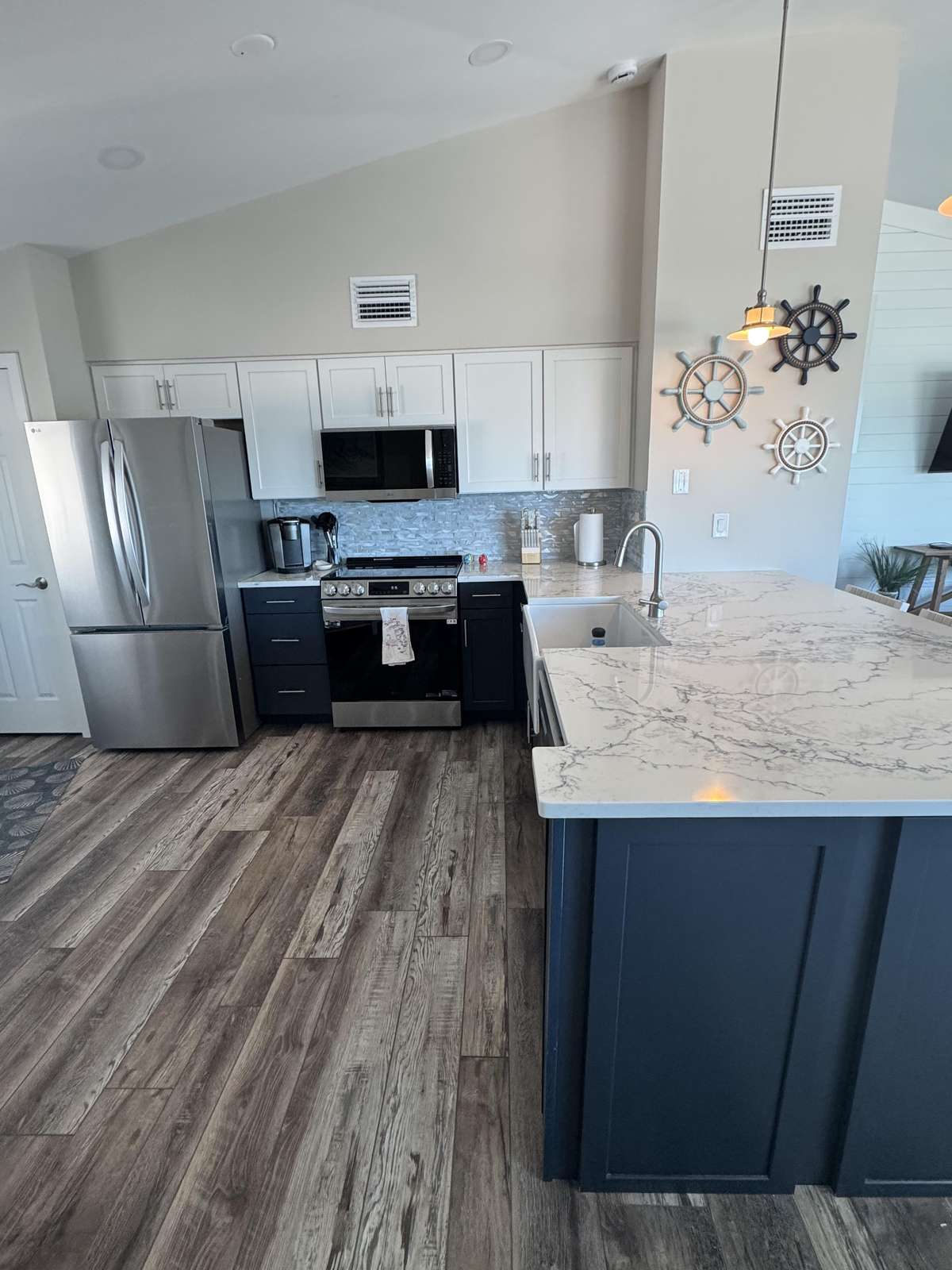 Modern kitchen with sleek appliances and spacious island seating