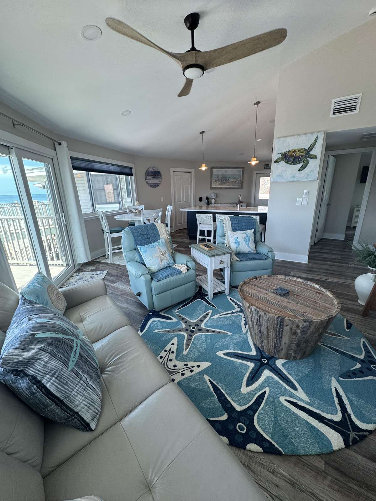 Cozy living room with panoramic windows and ocean views