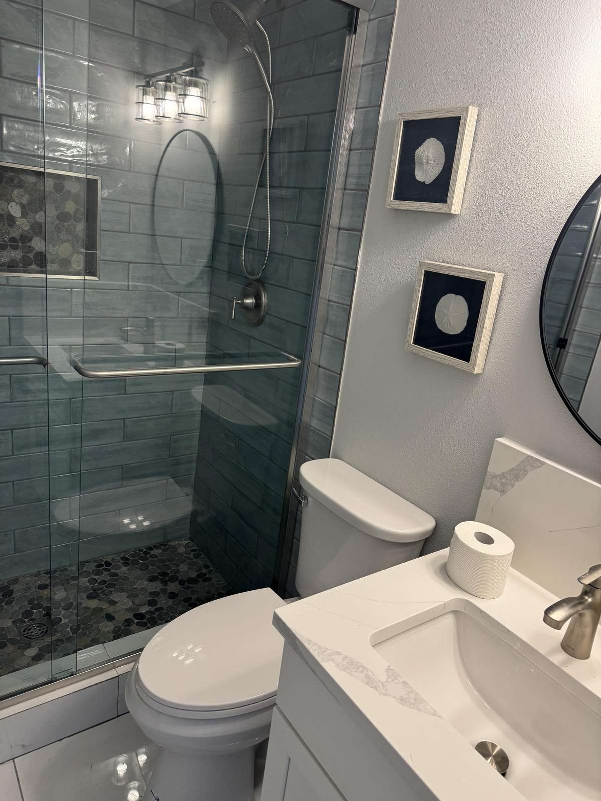 Guest bathroom with sleek glass shower and clean design