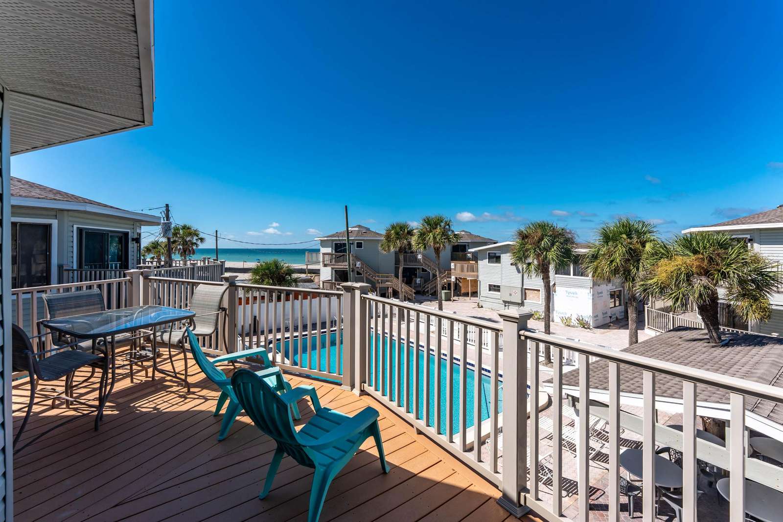 Deck with Chairs and Community Pool View