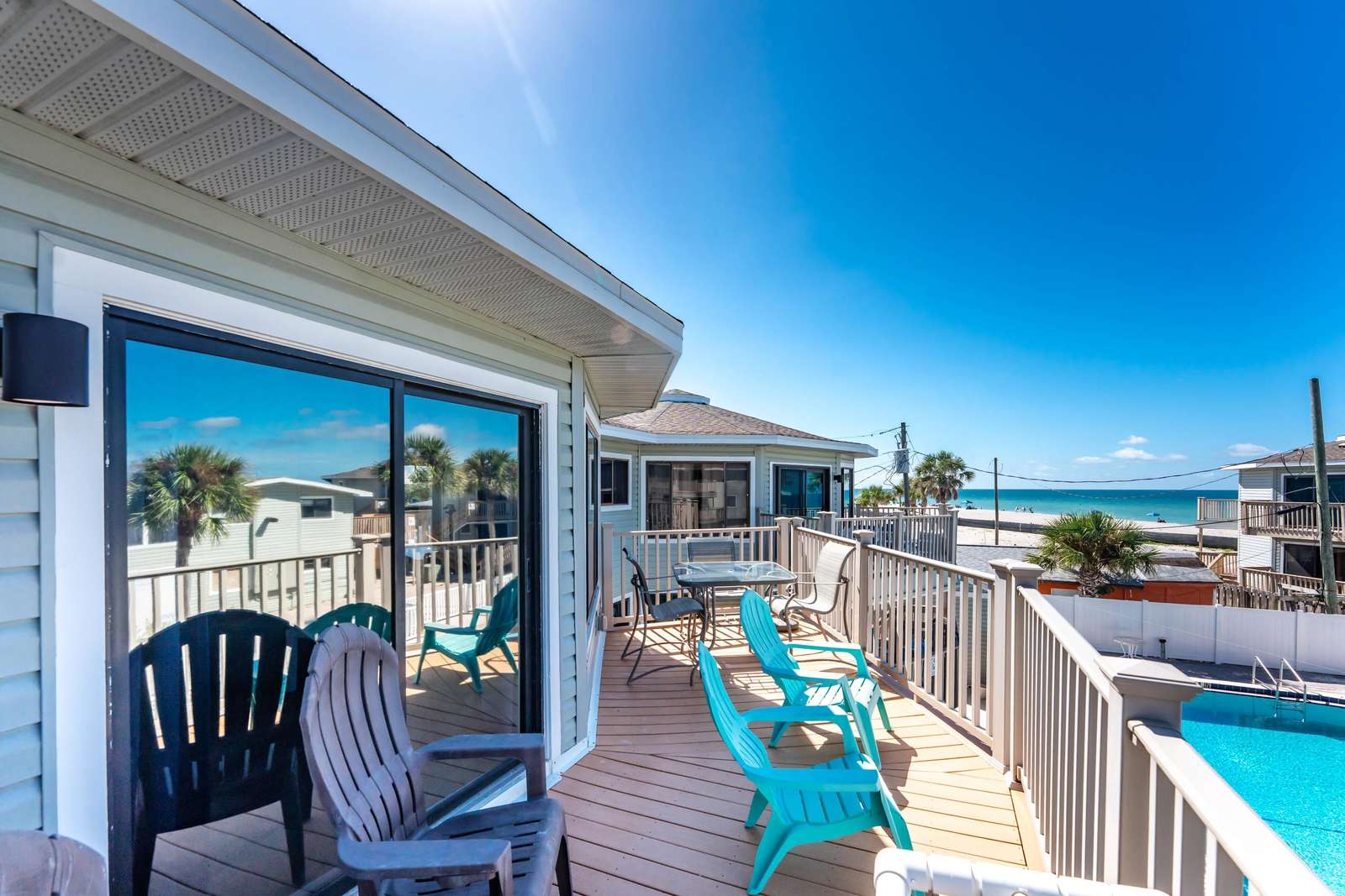 Deck with Chairs, Ocean &amp; Community Pool View