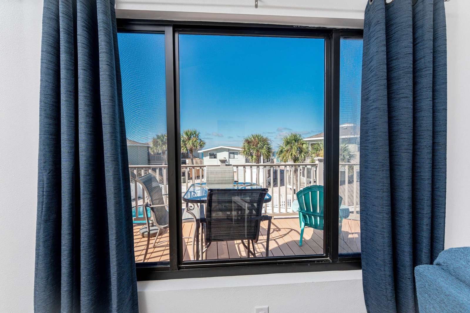 Living Room Window View (Deck and Community Pool)