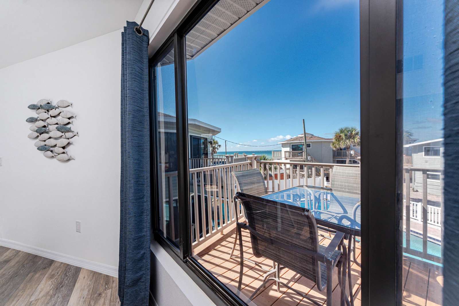 Living Room Window View (Deck and Community Pool)