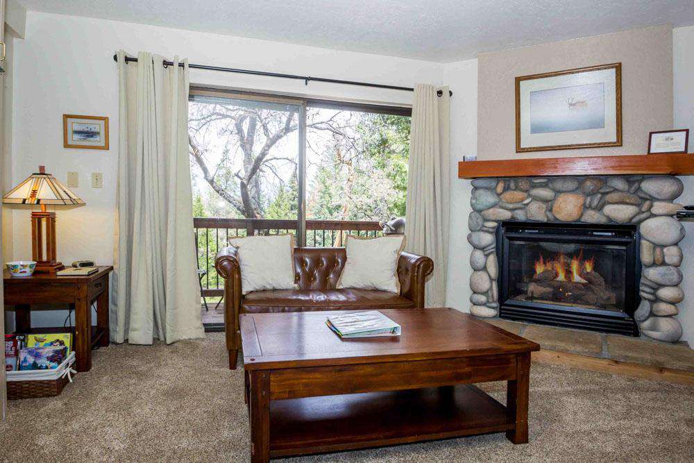 Lounge in the living room next to the gas fireplace (controlled by a thermostat on the wall)