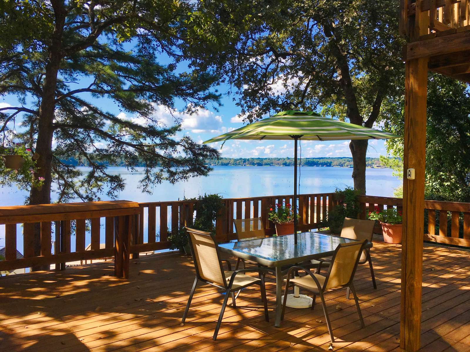 The shaded, upper main deck with cabana has a great view of the lake.