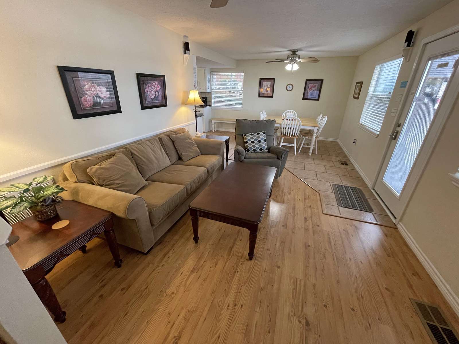 The living area from the stairway that goes up to the 2nd level.