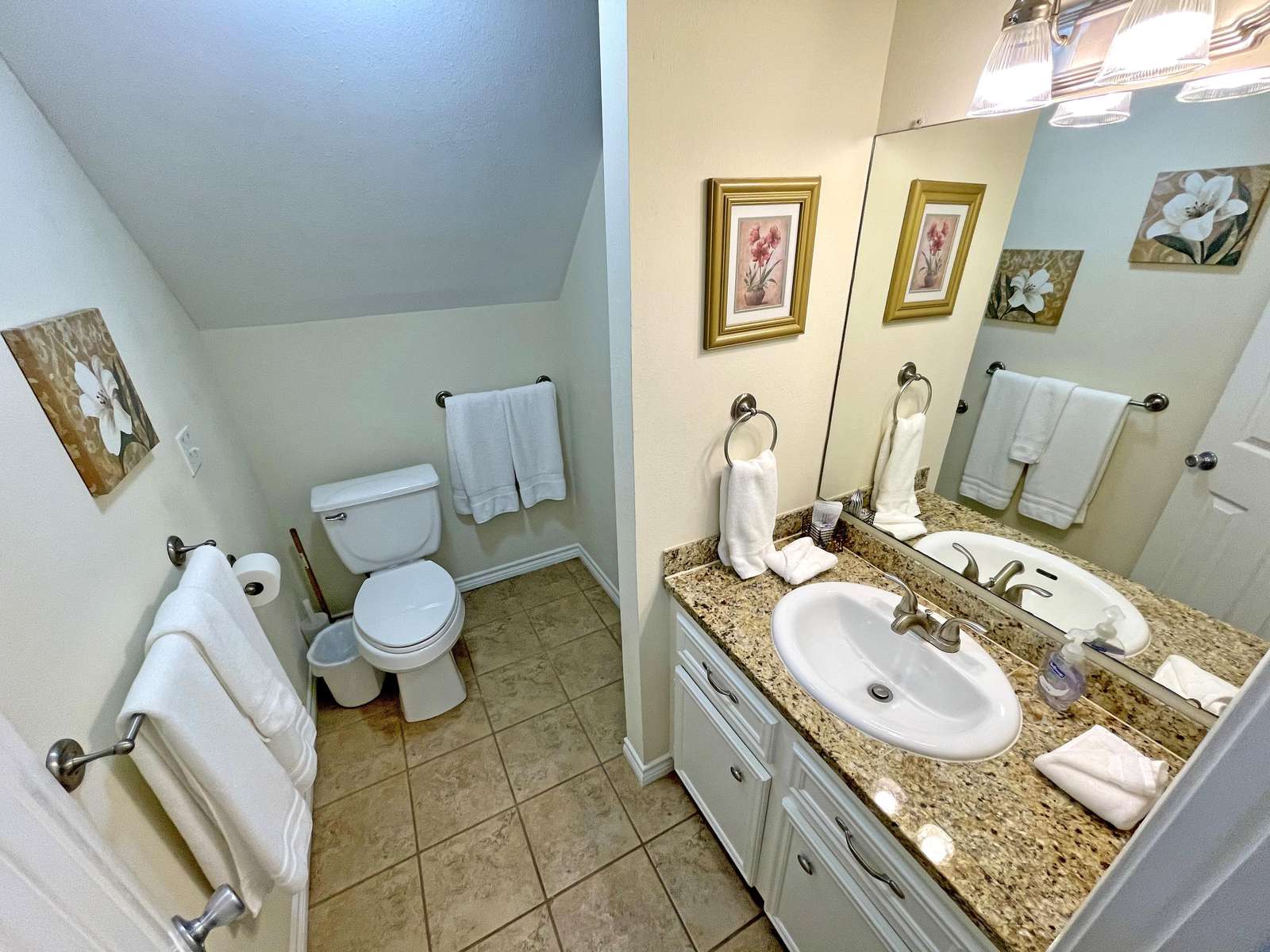As we go upstairs we have the 2nd Bathroom with tiled shower.