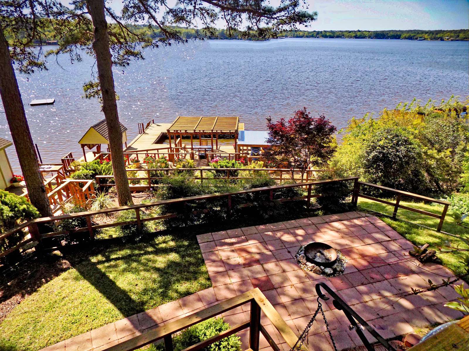 The view off the main deck is stunning. We love the water view with a shoreline not too distant. Take note of the firepit for making smores with the kids.