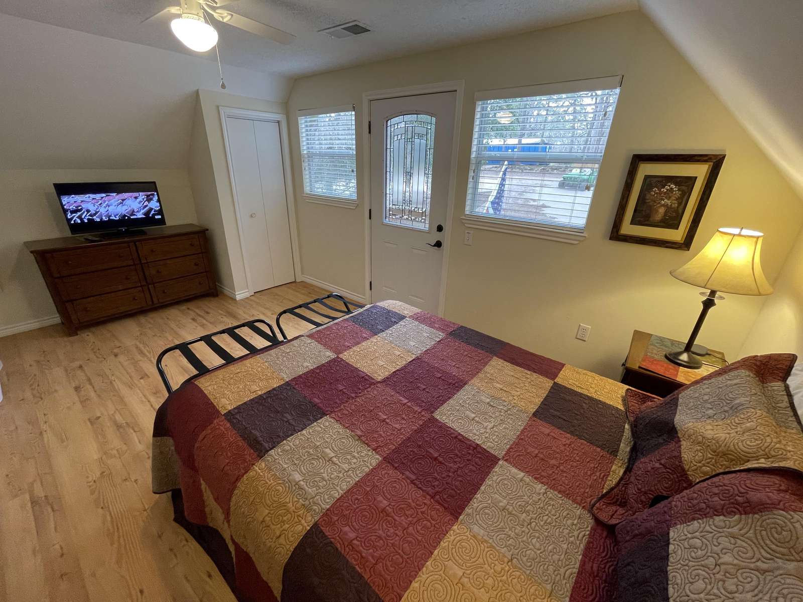The front upstairs bedroom has a small deck overlooking the quiet street and pretty front garden area.