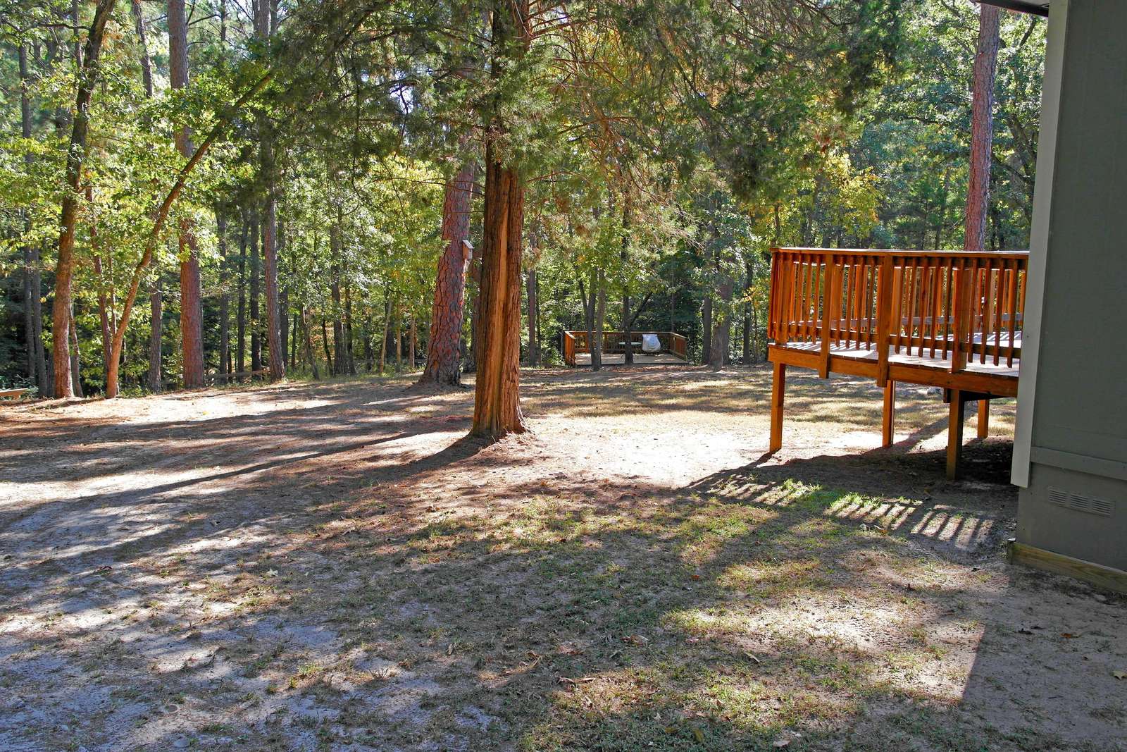 Looking from the left rear corner of the home towards the creek. Let's head over to the Fern Deck.