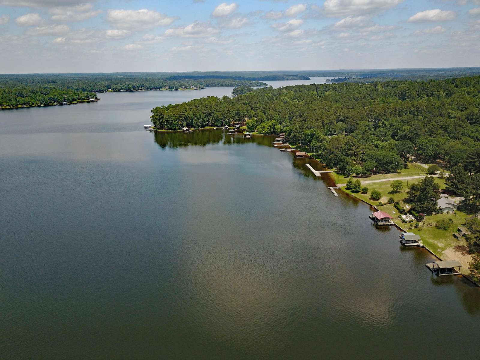 The cleared area to the right is the community park. It has piers on the water, bathrooms (keys at house) and a play ground