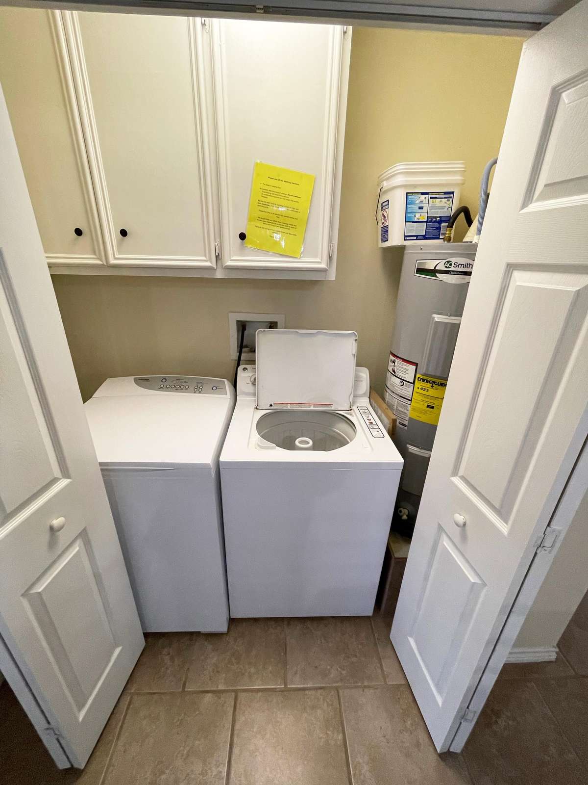 The laundry area is adjacent to the dining area.