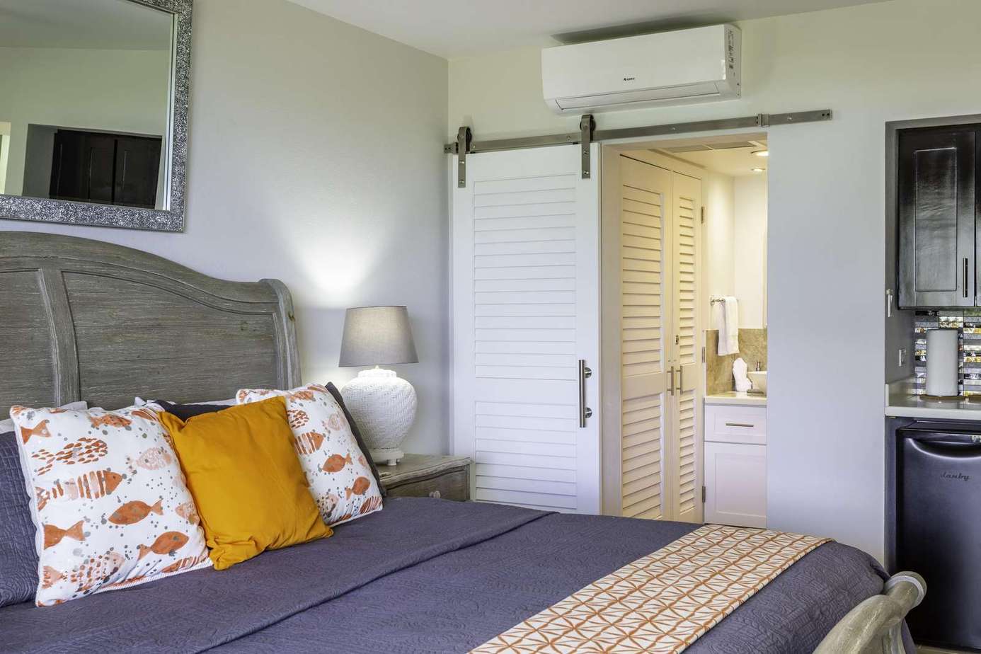 Cozy bedroom retreat with stylish barn door and soft lighting