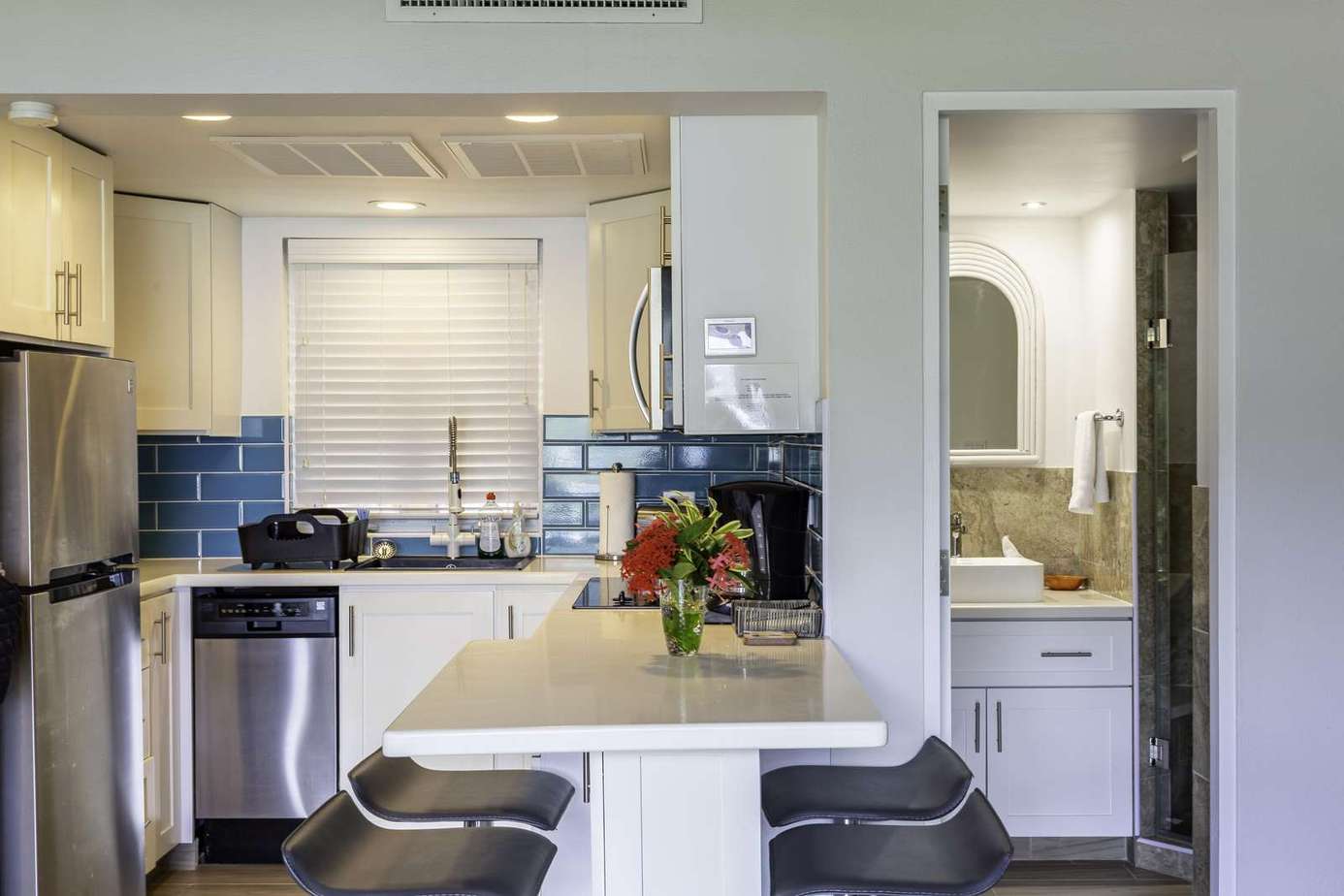 Modern kitchen with sleek appliances and cozy breakfast bar