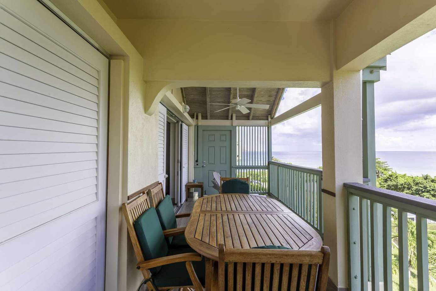 Covered balcony with panoramic views and cozy seating