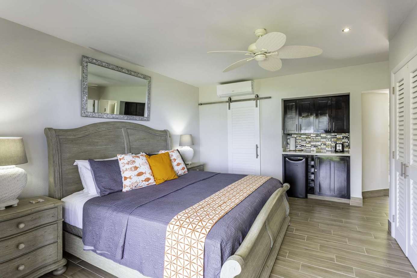 Cozy bedroom retreat with stylish decor and kitchenette access
